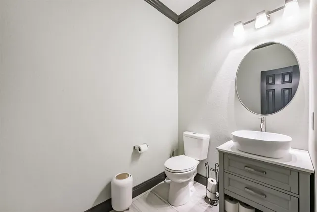 an aerial view of a house with a yard and large tree