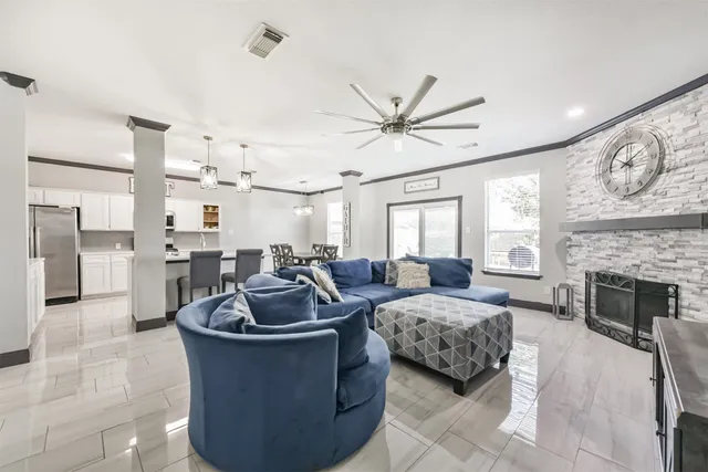 a living room with furniture and fireplace