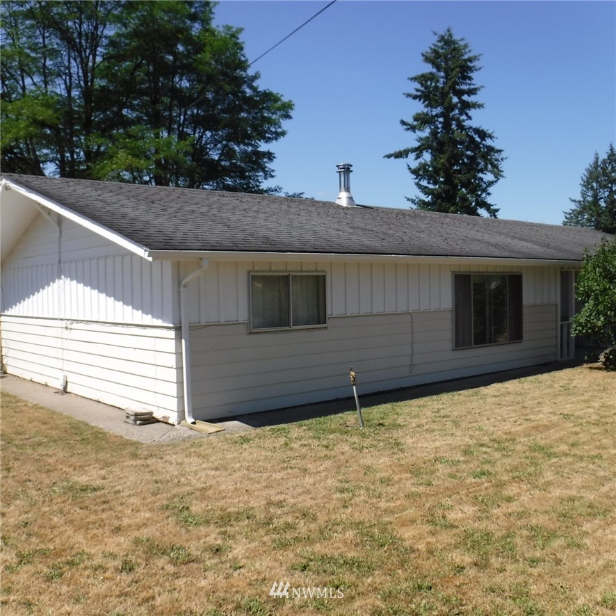 18107 Corvallis Street Southwest Rochester, WA 98579 - Photo 2 of 17 a house with trees in the background