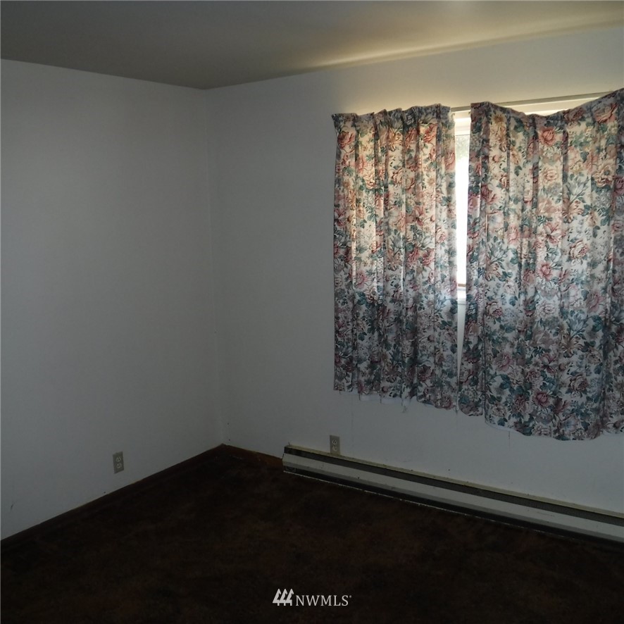 18107 Corvallis Street Southwest Rochester, WA 98579 - Photo 14 of 17 a view of a small space with wooden floor and a window