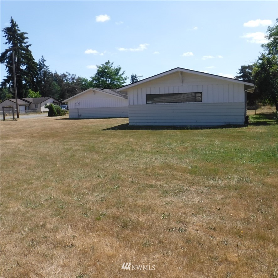 18107 Corvallis Street Southwest Rochester, WA 98579 - Photo 6 of 17 a front view of house with yard and trees