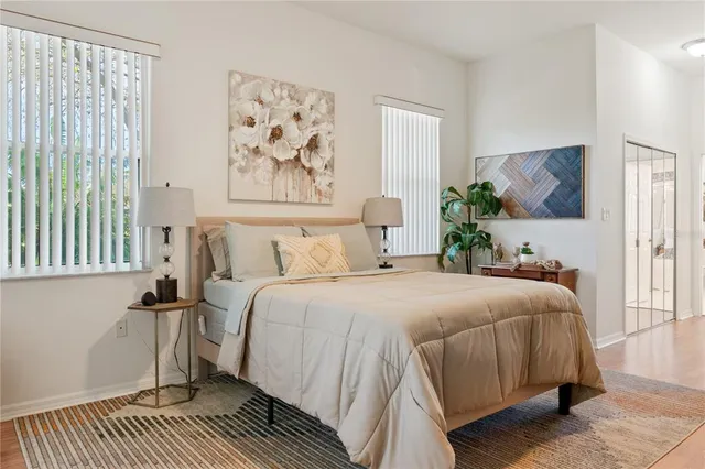 a bedroom with a large bed and a window