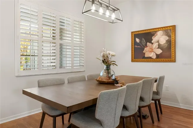 a dining room with furniture and window
