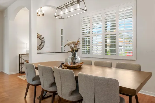 a dining room with furniture and window