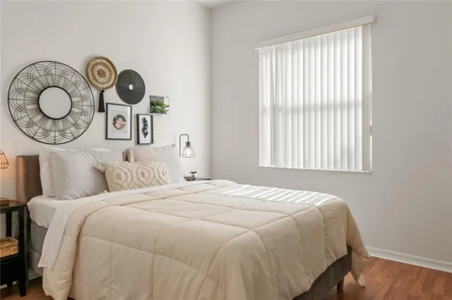 a bedroom with a bed and a window