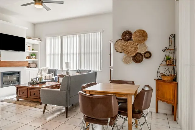 a dining room with furniture and window