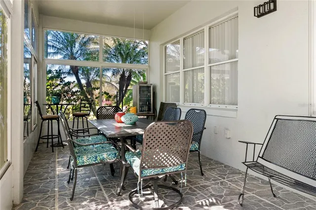 a view of a dining room with furniture window and outside view