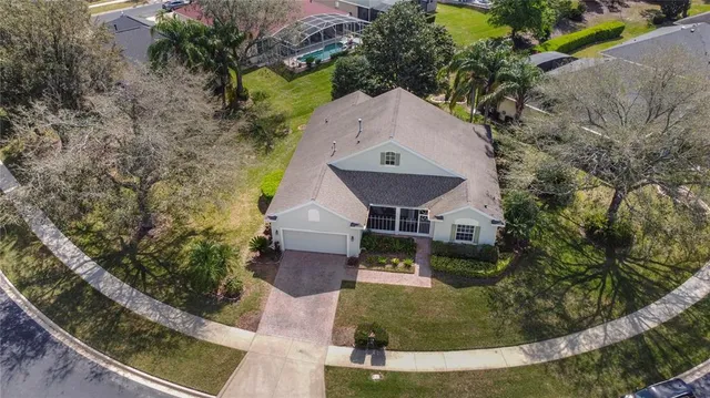 an aerial view of a house with outdoor space
