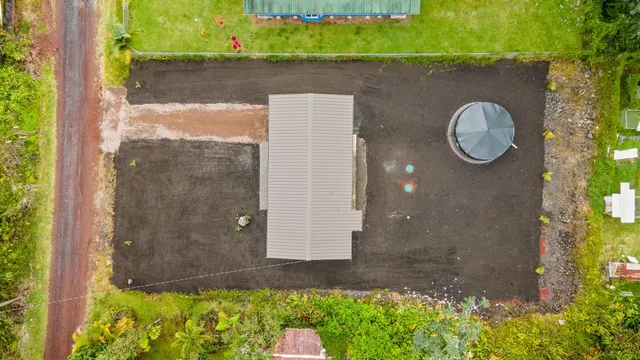 a backyard of a house with a yard and outdoor seating
