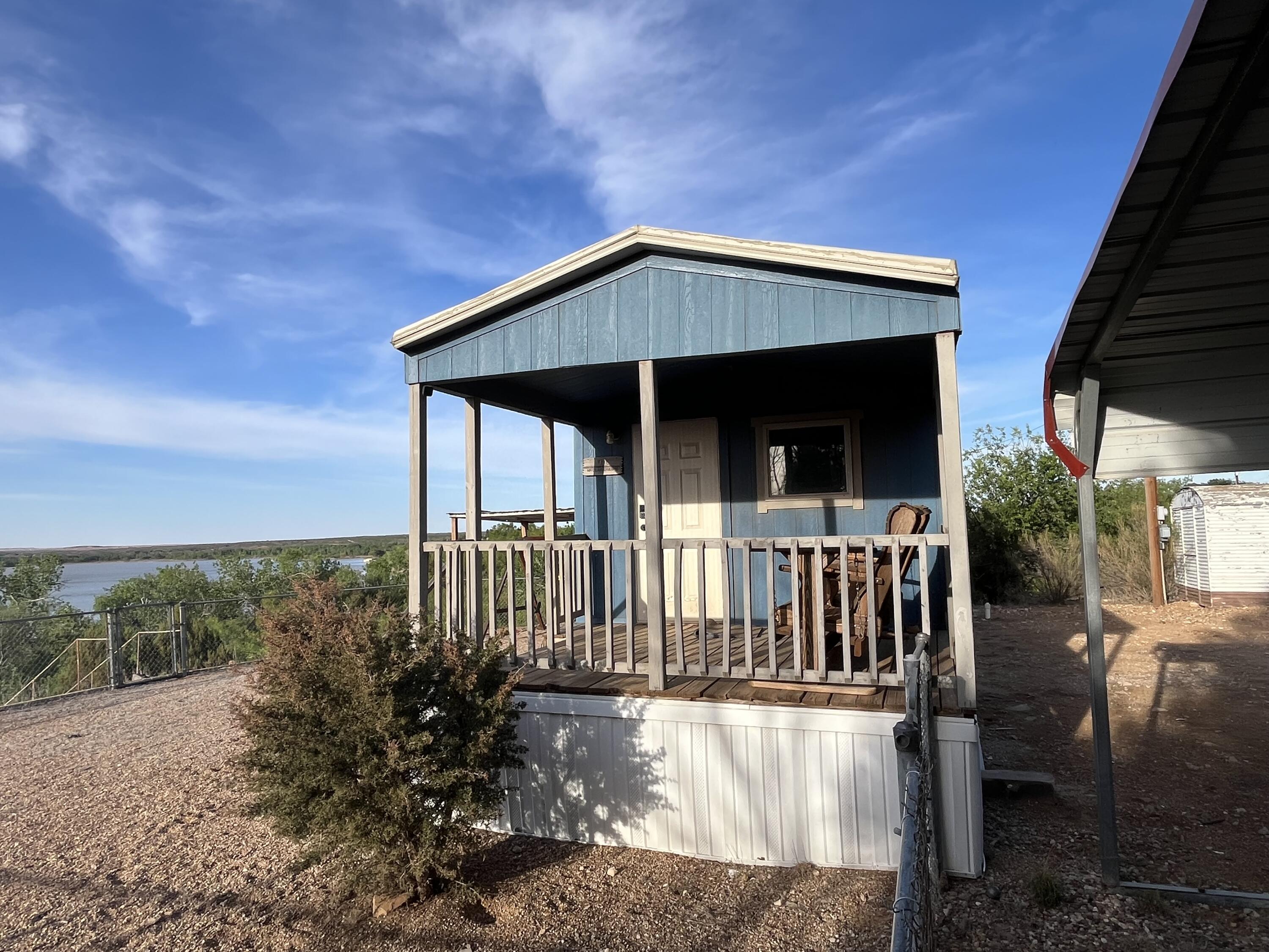 145 Lakesite Road Spur, TX 79370 - Photo 12 of 12 a view of a house with backyard and porch