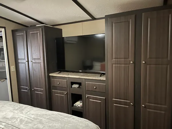 a kitchen with a refrigerator and a sink