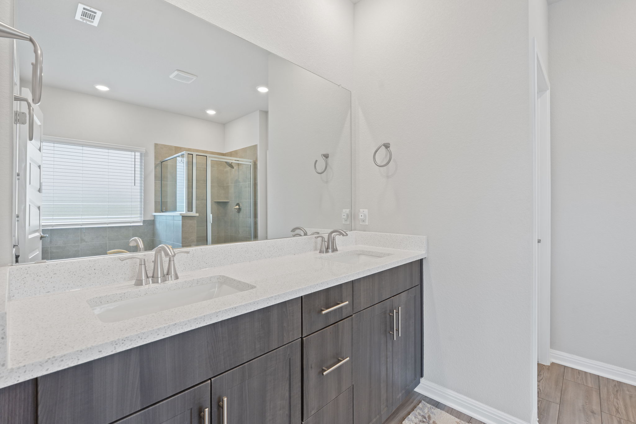 571 Sue Peaks Loop Dripping Springs, TX 78620 - Photo 16 of 29 a bathroom with a sink and a mirror
