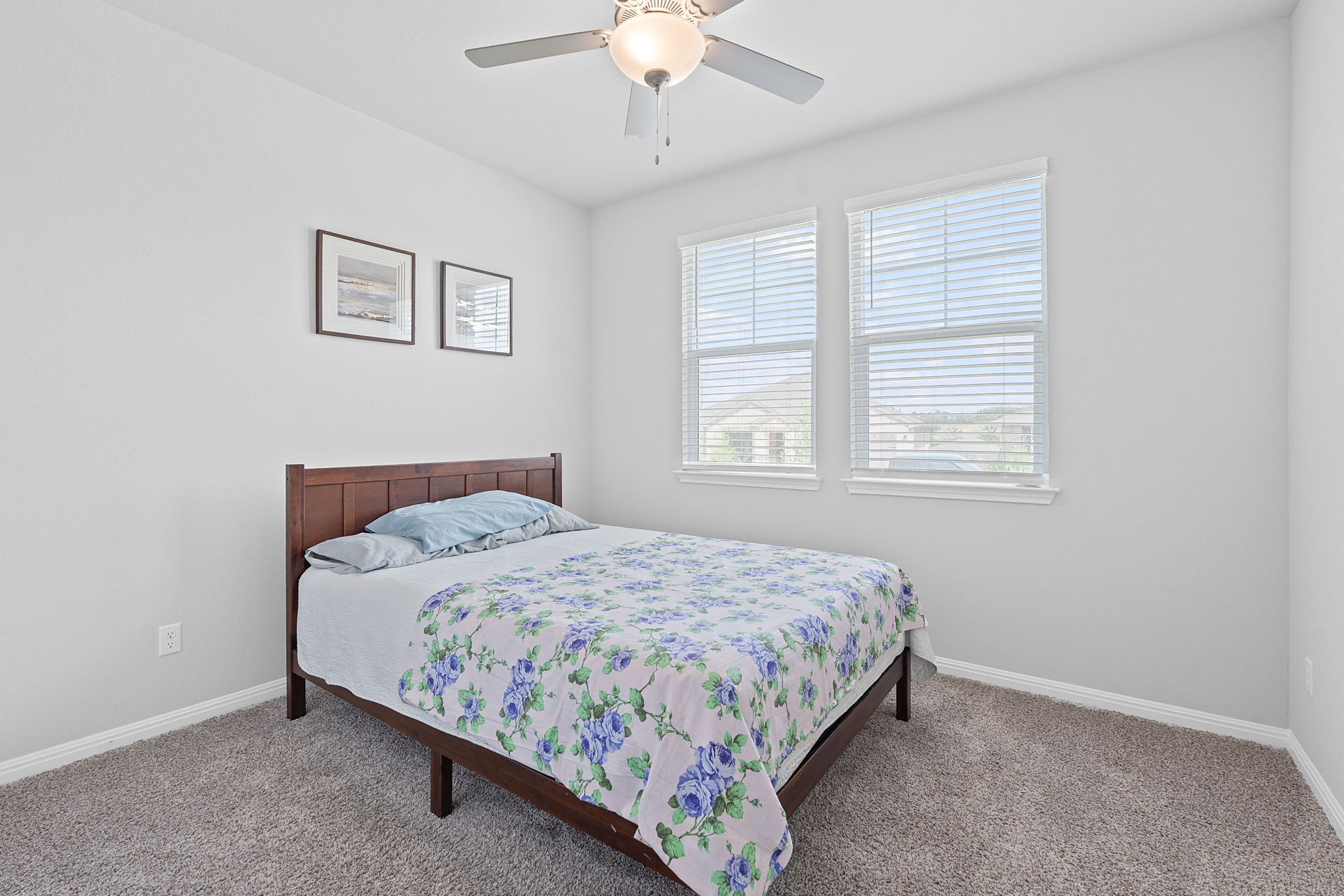 571 Sue Peaks Loop Dripping Springs, TX 78620 - Photo 17 of 29 a bedroom with a bed and a window