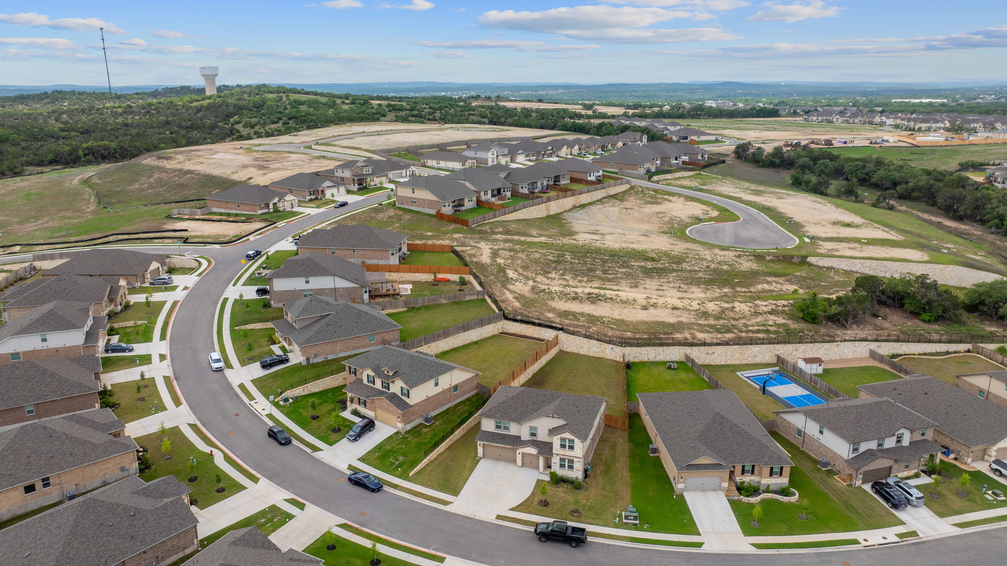 571 Sue Peaks Loop Dripping Springs, TX 78620 - Photo 2 of 29 an aerial view of residential houses with outdoor space