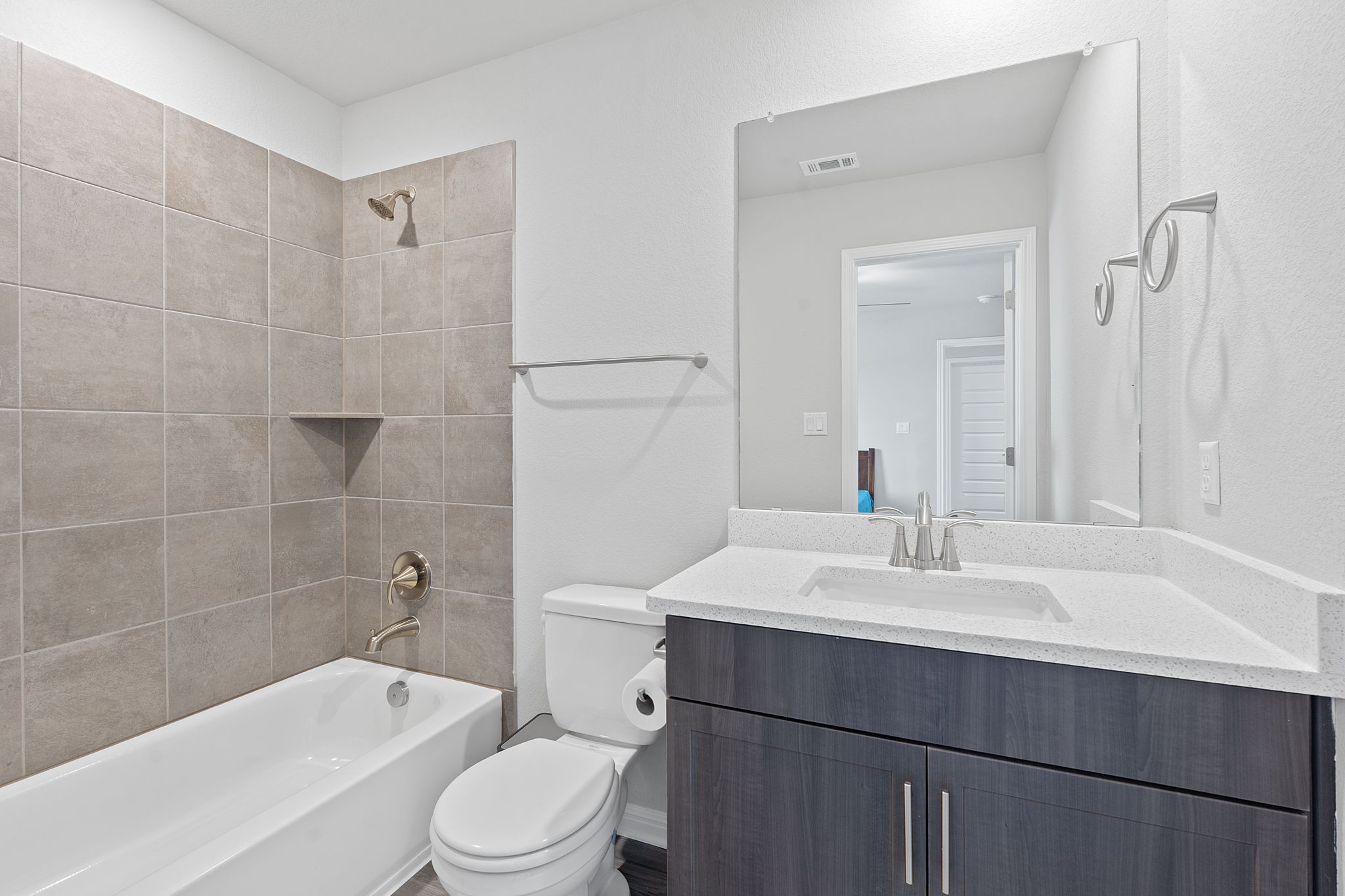 571 Sue Peaks Loop Dripping Springs, TX 78620 - Photo 23 of 29 a bathroom with a sink a toilet and shower