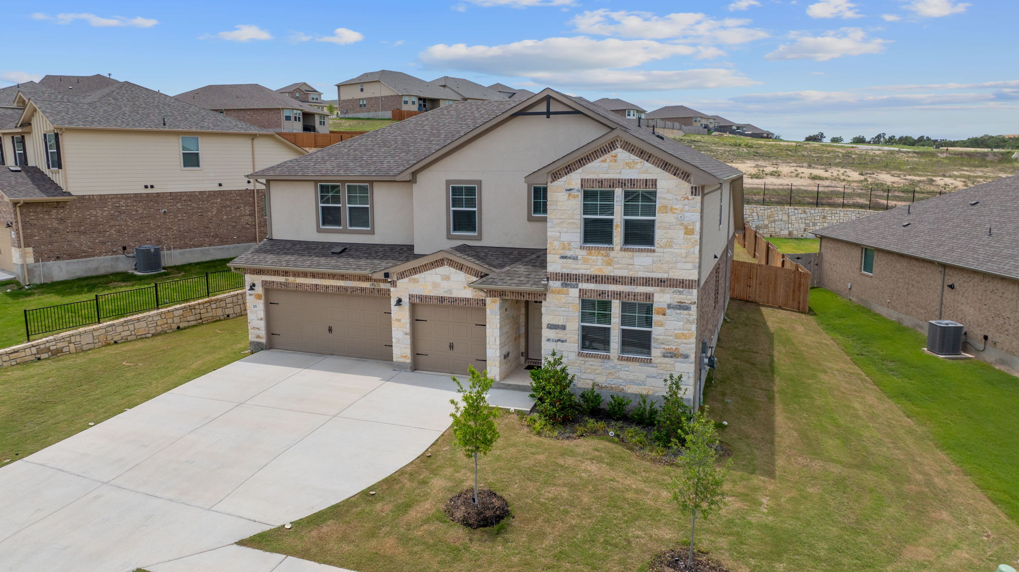 571 Sue Peaks Loop Dripping Springs, TX 78620 - Photo 29 of 29 front view of house with a yard