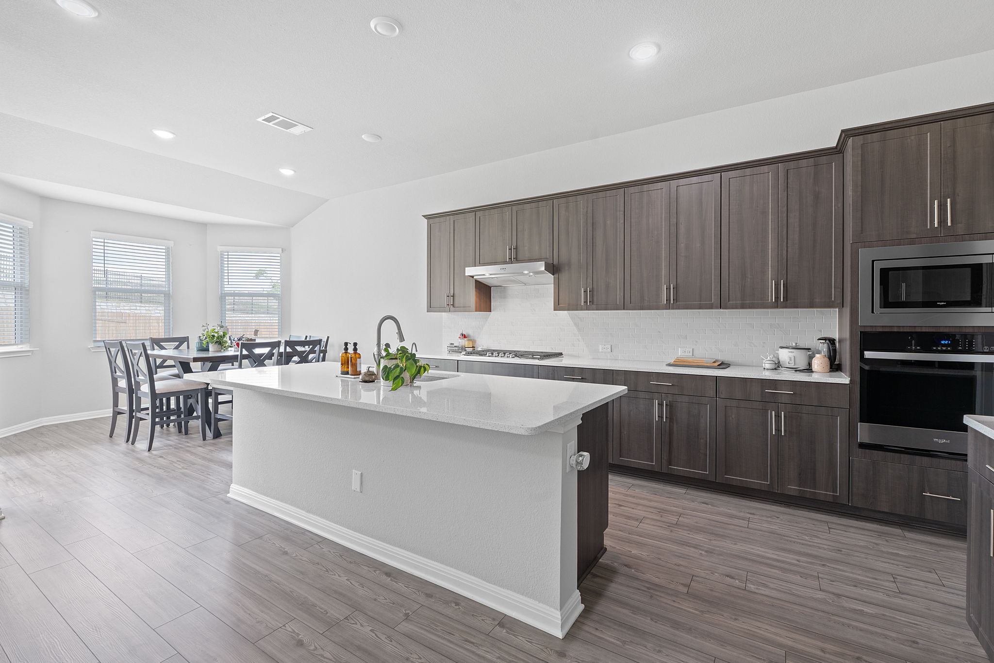 571 Sue Peaks Loop Dripping Springs, TX 78620 - Photo 5 of 29 a kitchen with a sink cabinets and wooden floor