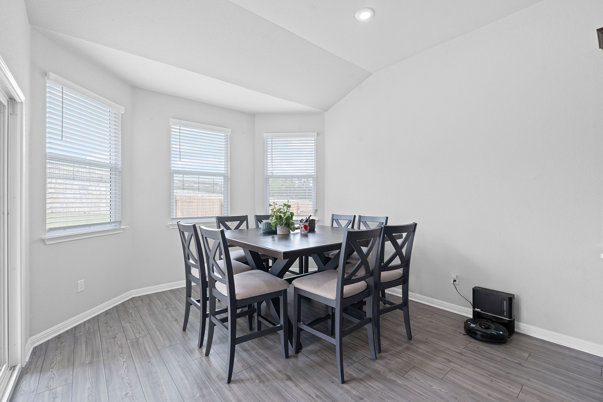 571 Sue Peaks Loop Dripping Springs, TX 78620 - Photo 8 of 29 a view of a dining room with furniture and wooden floor