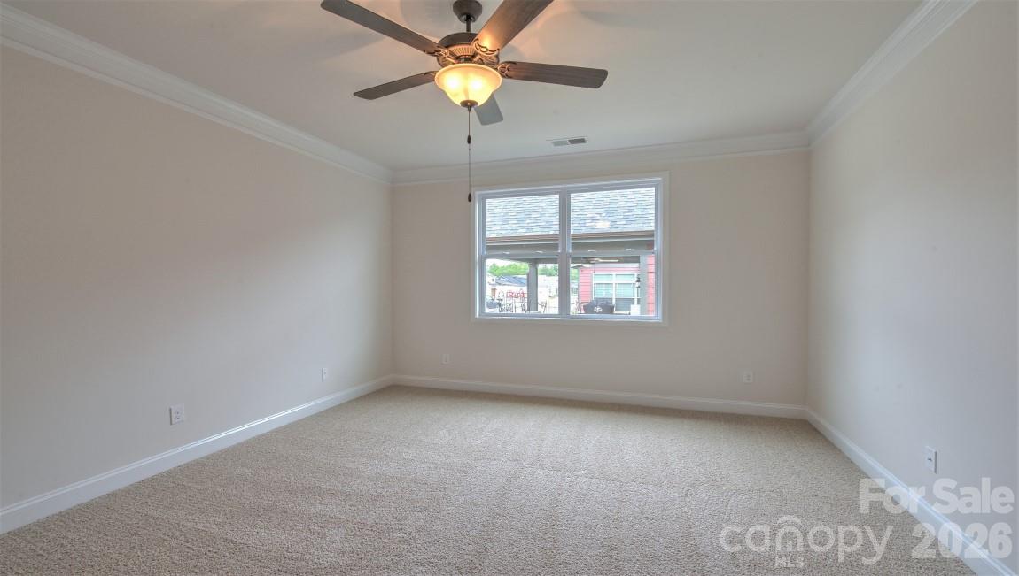 649 River Btm Road Fletcher, NC 28732 - Photo 30 of 40 an empty room with a window and a fan