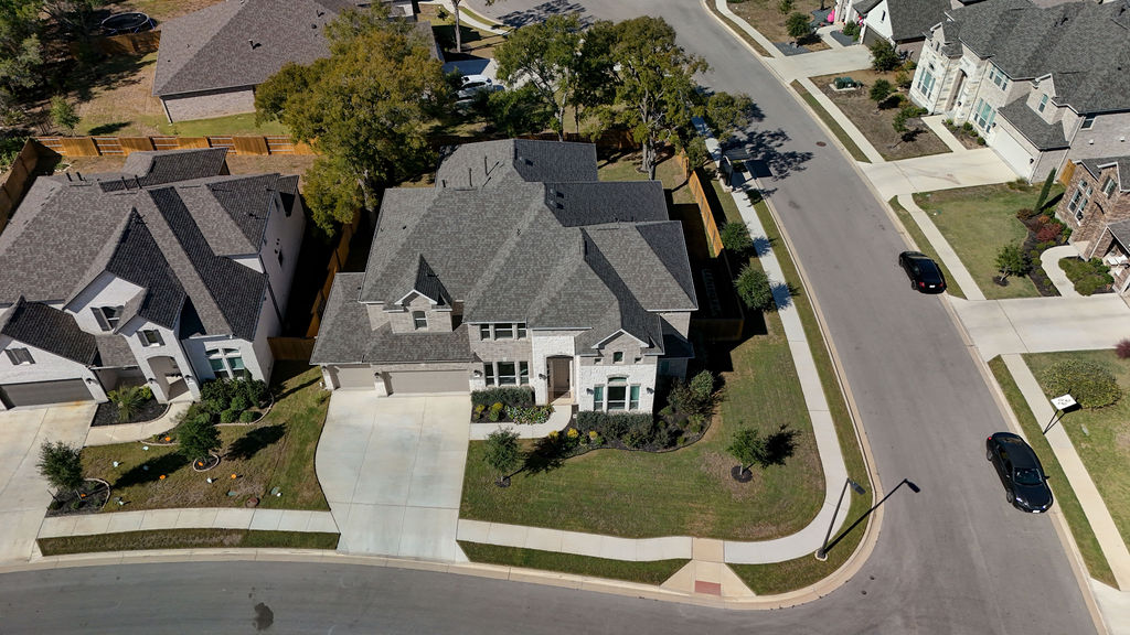 351 Pigeon River Road Kyle, TX 78640 - Photo 2 of 40 Aerial overview of property's location featuring nearby suburban area
