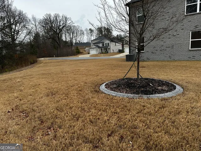 a view of swimming pool with a yard