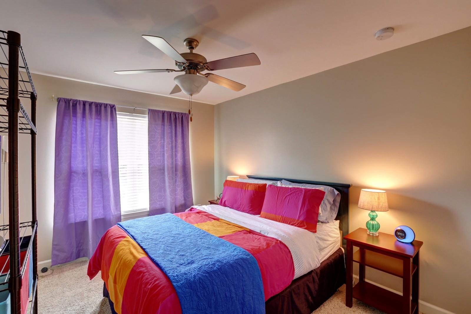 388 Churchill Bayou Road Santa Rosa Beach, FL 32459 - Photo 17 of 23 a bedroom with a bed and a chandelier