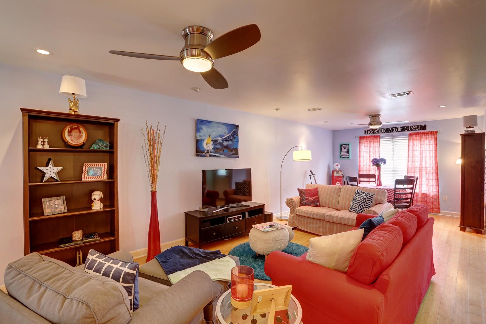 388 Churchill Bayou Road Santa Rosa Beach, FL 32459 - Photo 10 of 23 a living room with furniture a ceiling fan and a window