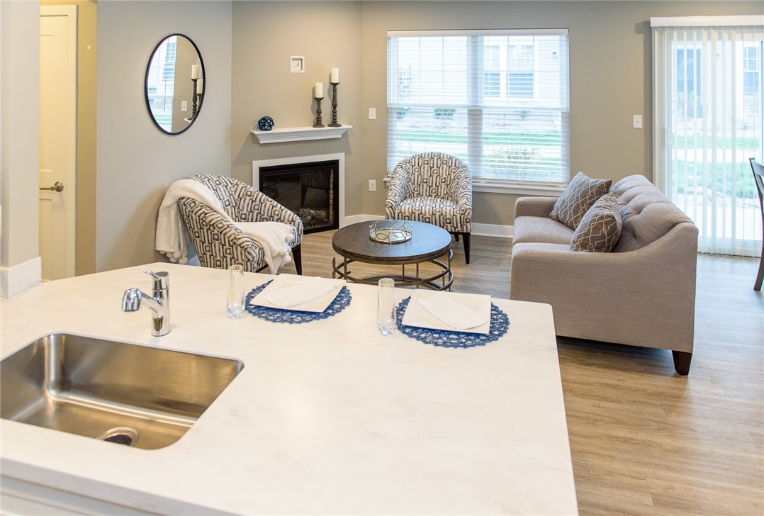 1282 Lehigh Station Road, Unit 3102 Henrietta, NY 14467 - Photo 3 of 17 Typical Great Room view from the kitchen area