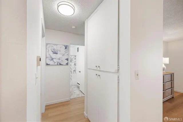 a bathroom with a bathtub shower sink vanity and toilet