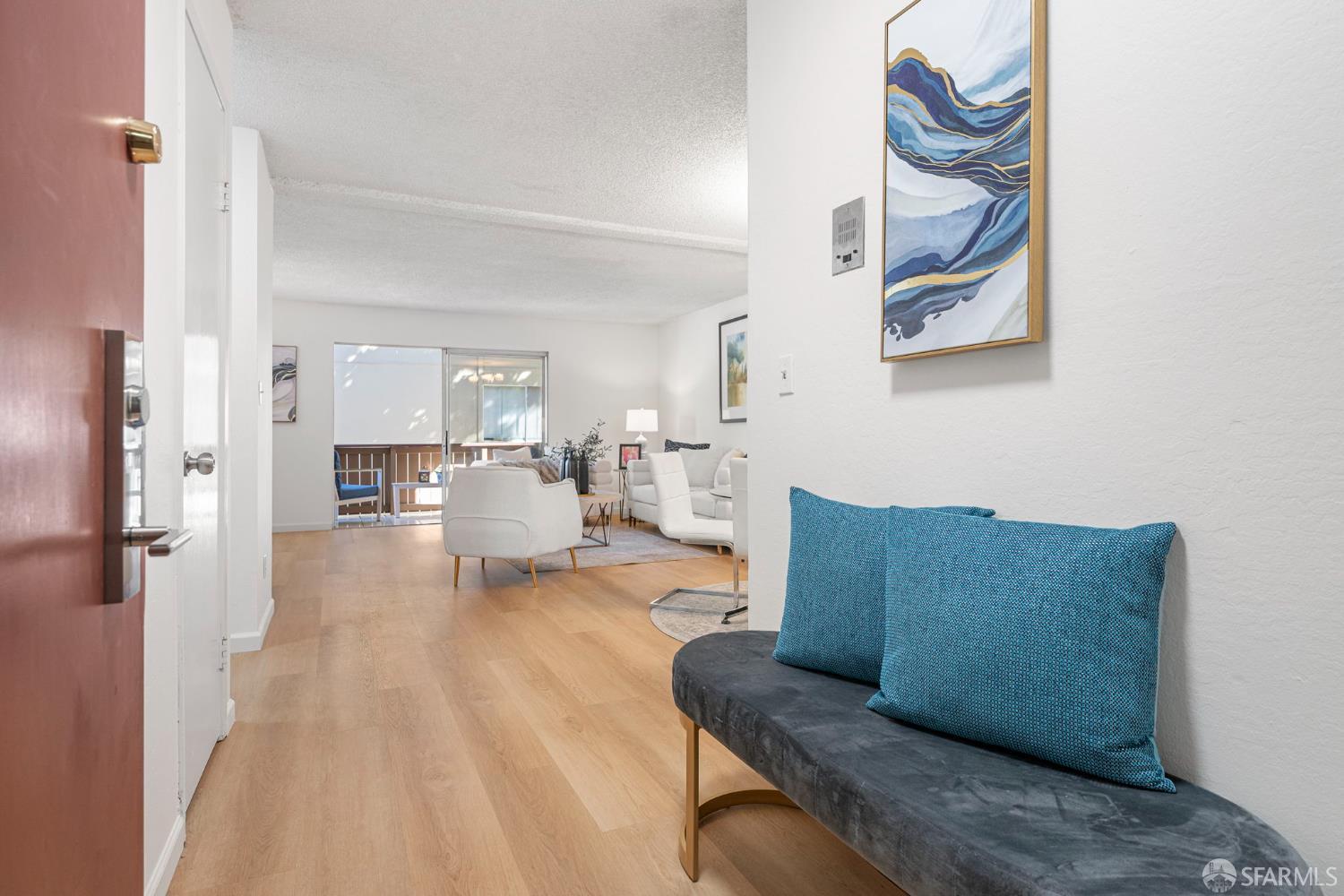 1327 Webster Street, Unit B210 Alameda, CA 94501 - Photo 2 of 54 a living room with furniture and a wooden floor