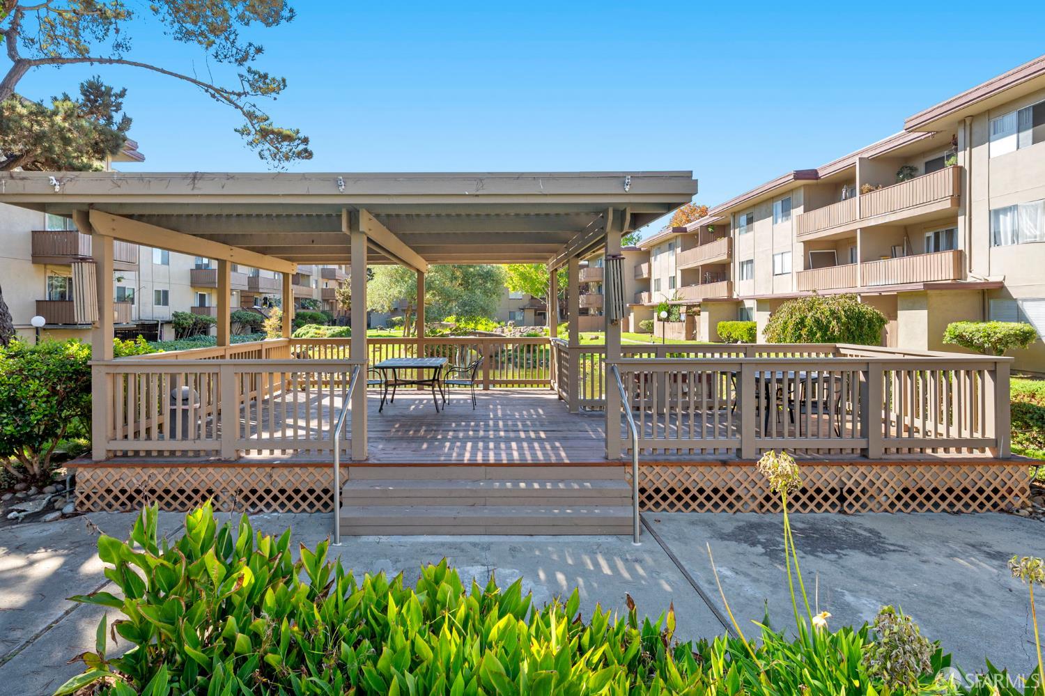 1327 Webster Street, Unit B210 Alameda, CA 94501 - Photo 28 of 54 a view of a house with a small yard and wooden fence