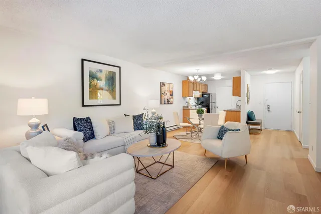 a living room with furniture and a lamp