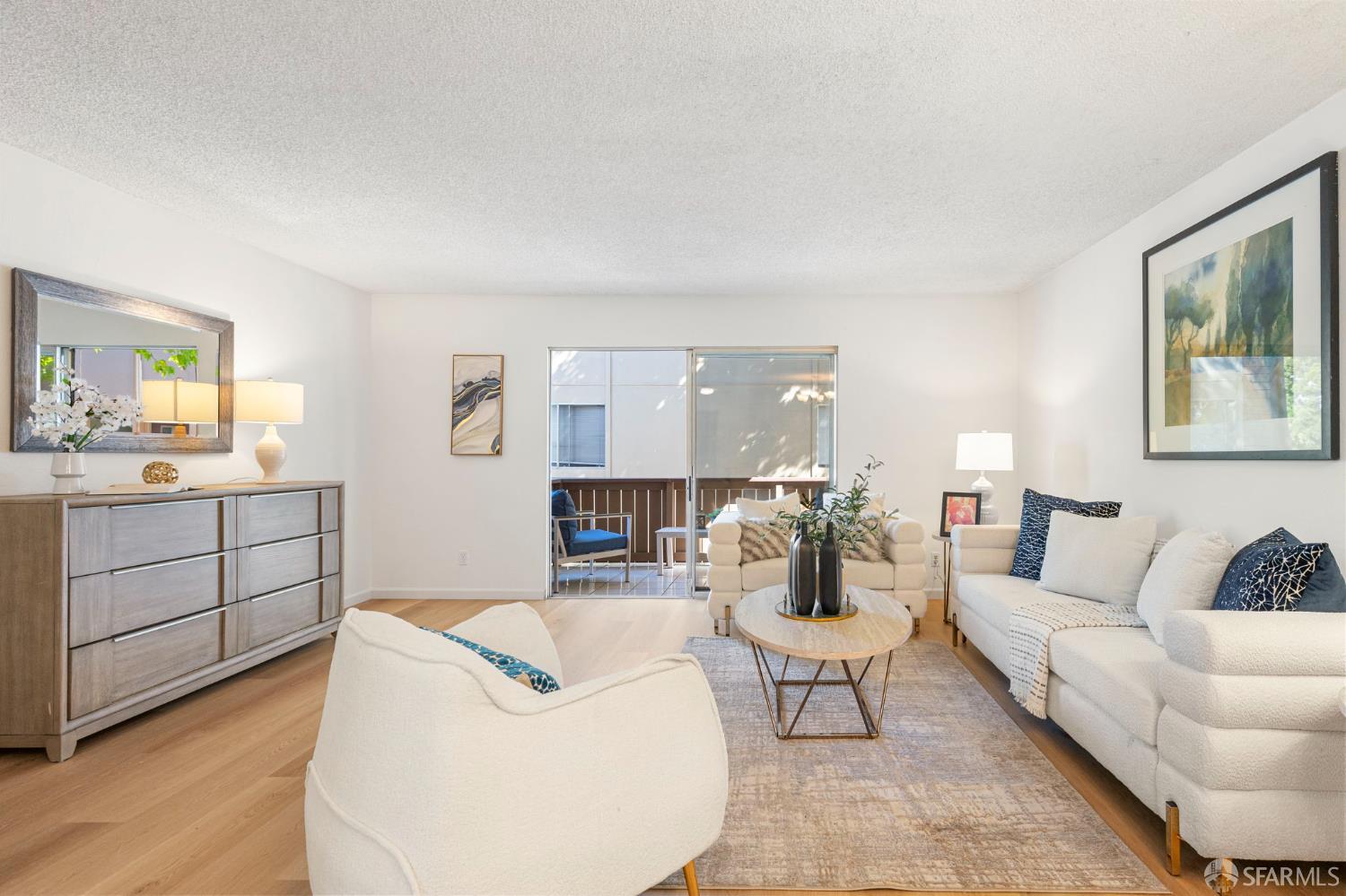 1327 Webster Street, Unit B210 Alameda, CA 94501 - Photo 4 of 54 a living room with furniture a rug and white walls