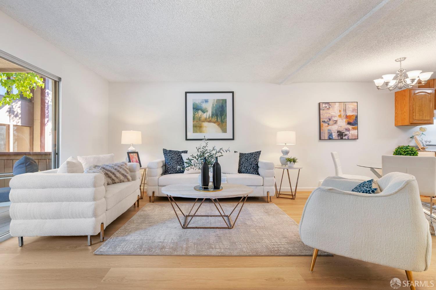 1327 Webster Street, Unit B210 Alameda, CA 94501 - Photo 6 of 54 a living room with furniture and a painting on the wall