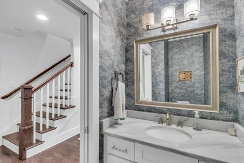 a bathroom with a sink and a mirror