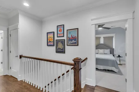 a bedroom with furniture and a wooden floor