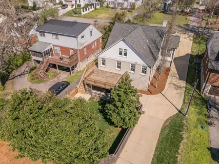 an aerial view of house with yard