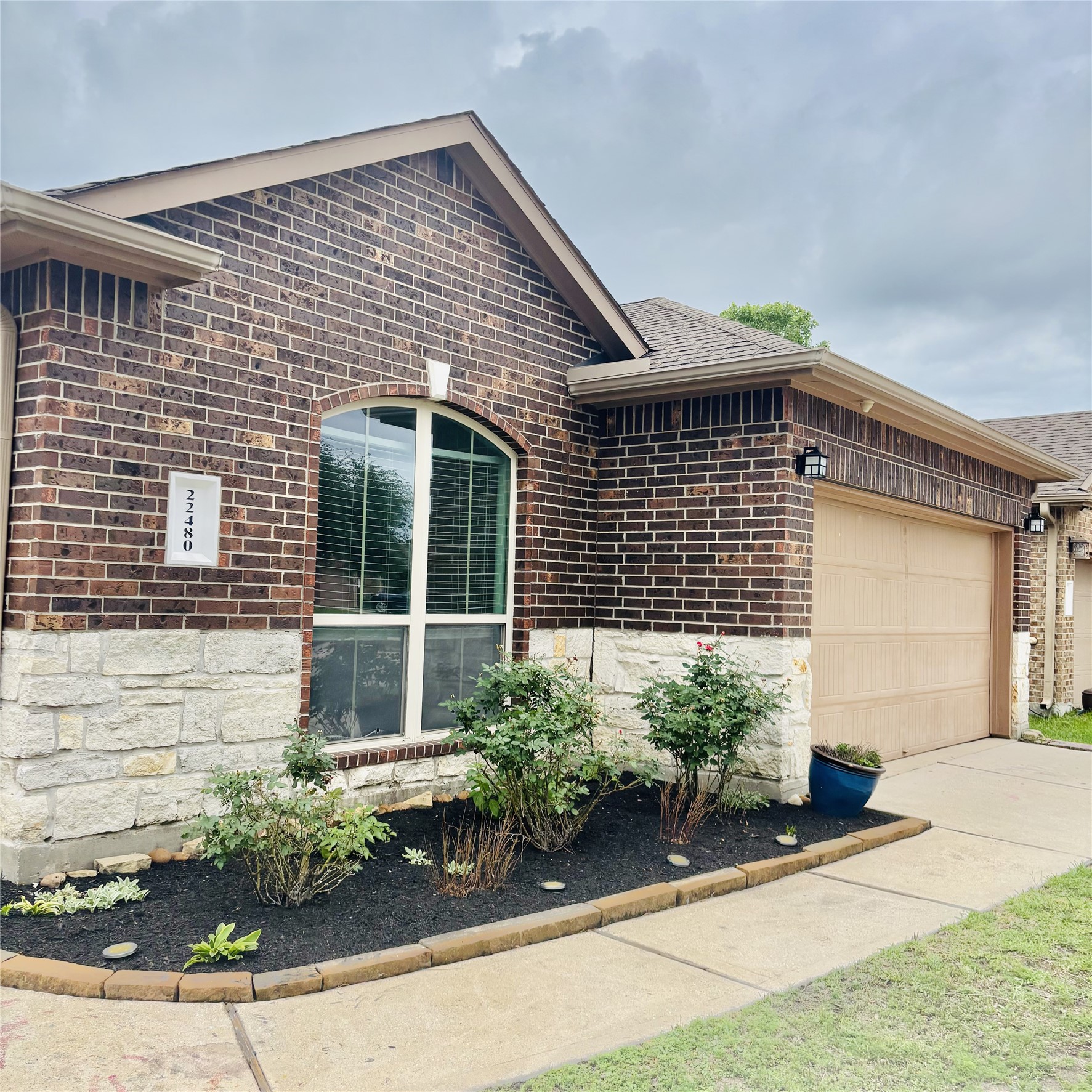 22480 Toronado Ridge Lane Porter, TX 77365 - Photo 3 of 42 a front view of a house with garden