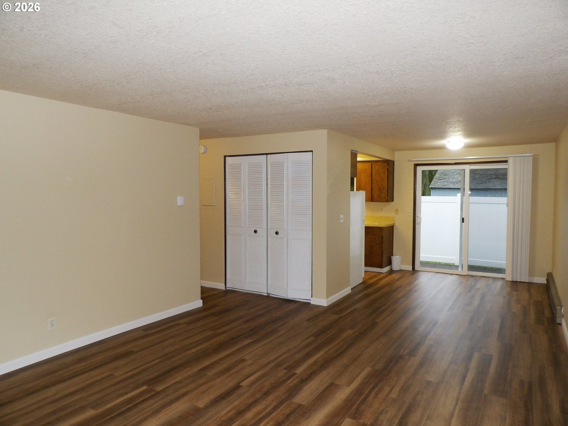 3124 19th Place Forest Grove, OR 97116 - Photo 20 of 31 a view of an empty room with wooden floor and a window