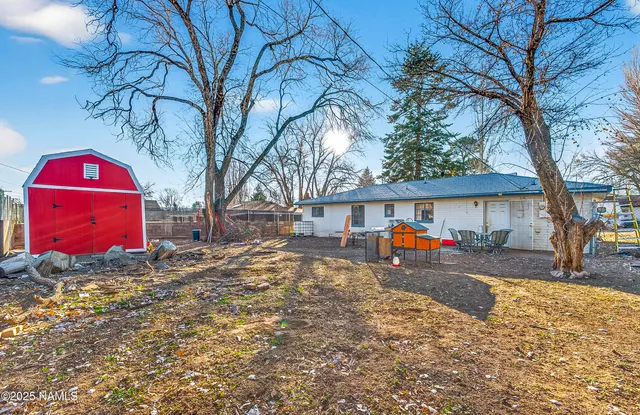 a view of a house with a yard covered in snow