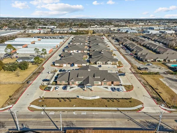 an aerial view of residential houses with outdoor space