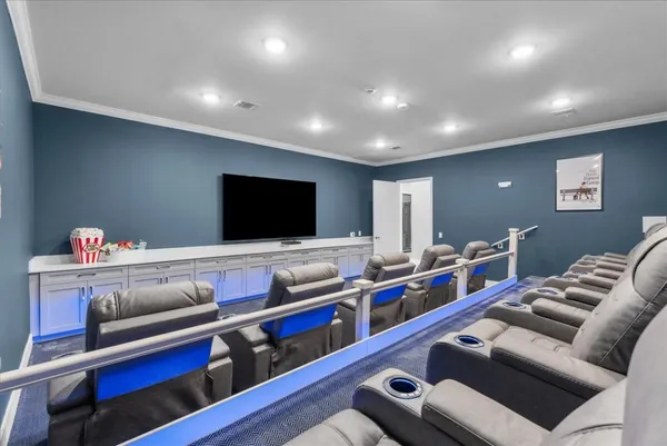 a room with gym equipment and a flat screen tv