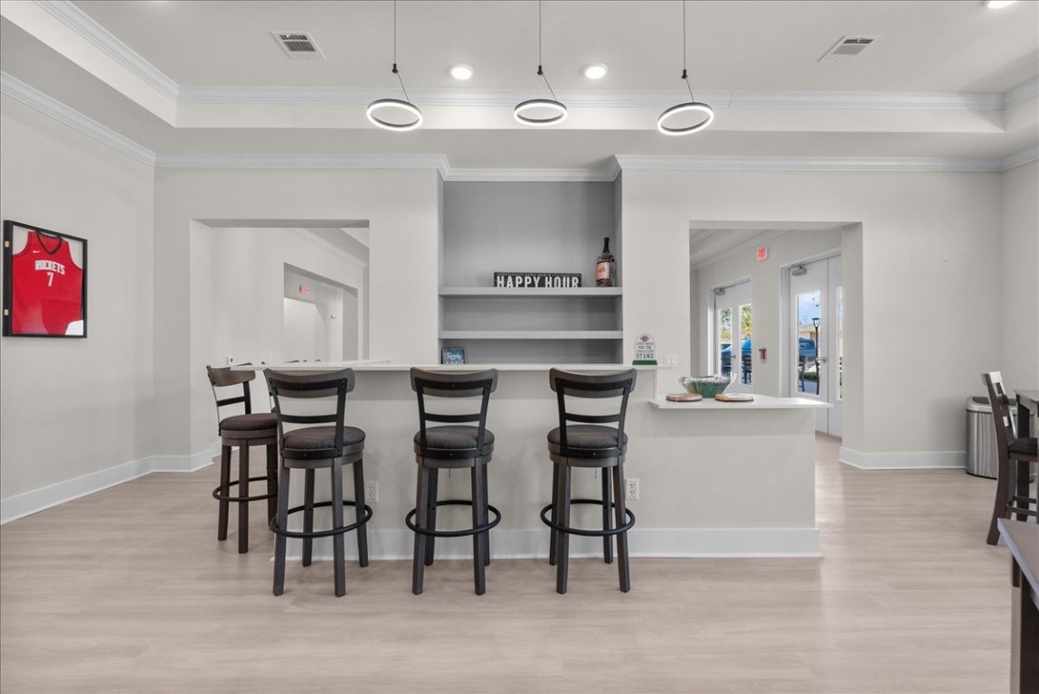 540 Hobbs Road, Unit D1 League City, TX 77573 - Photo 33 of 44 a kitchen with a dining table chairs cabinets and stainless steel appliances