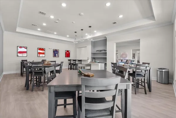 a living room with kitchen island granite countertop furniture and a sink