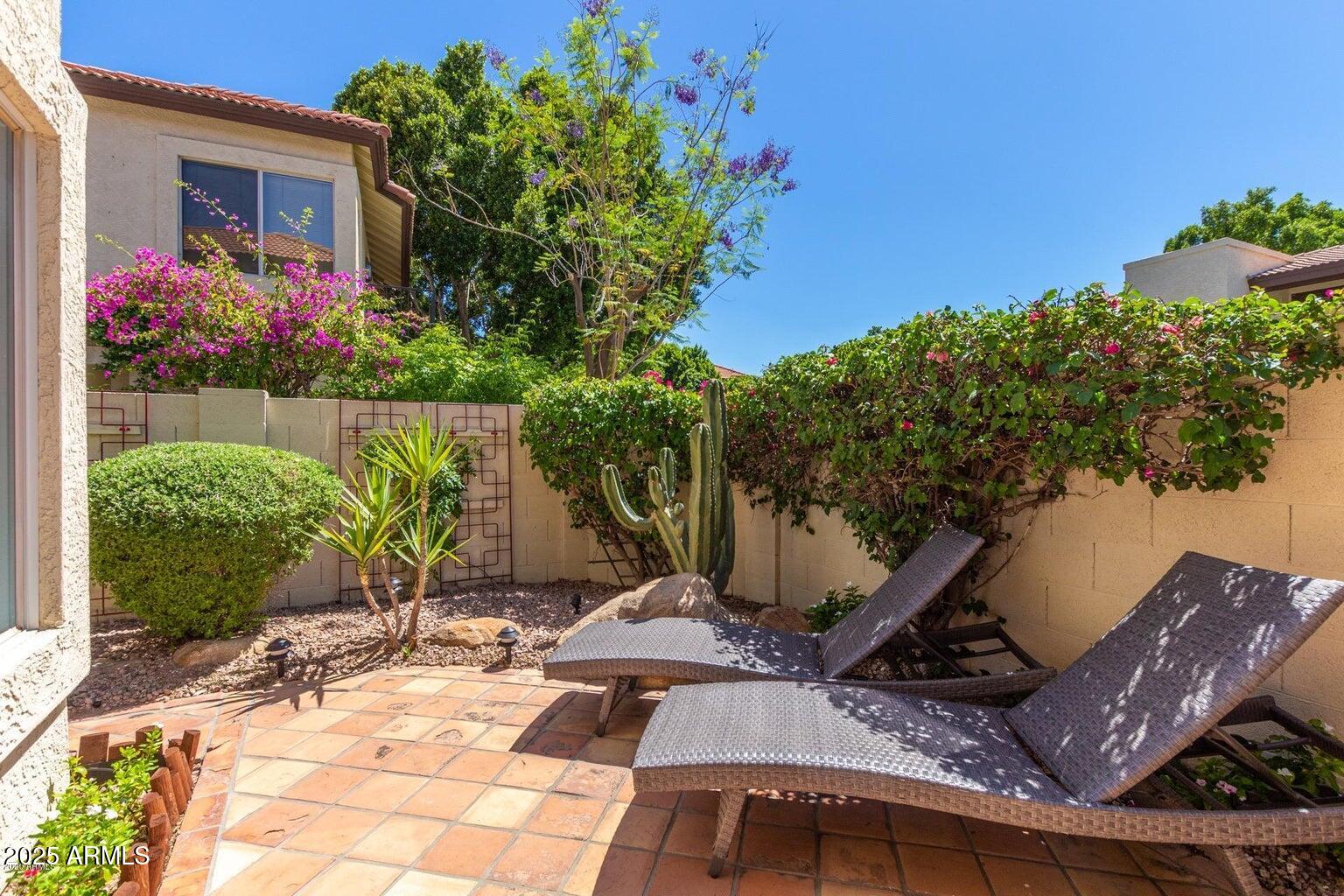 8841 South 51st Street, Unit 1 Phoenix, AZ 85044 - Photo 4 of 23 a front view of a house with a yard