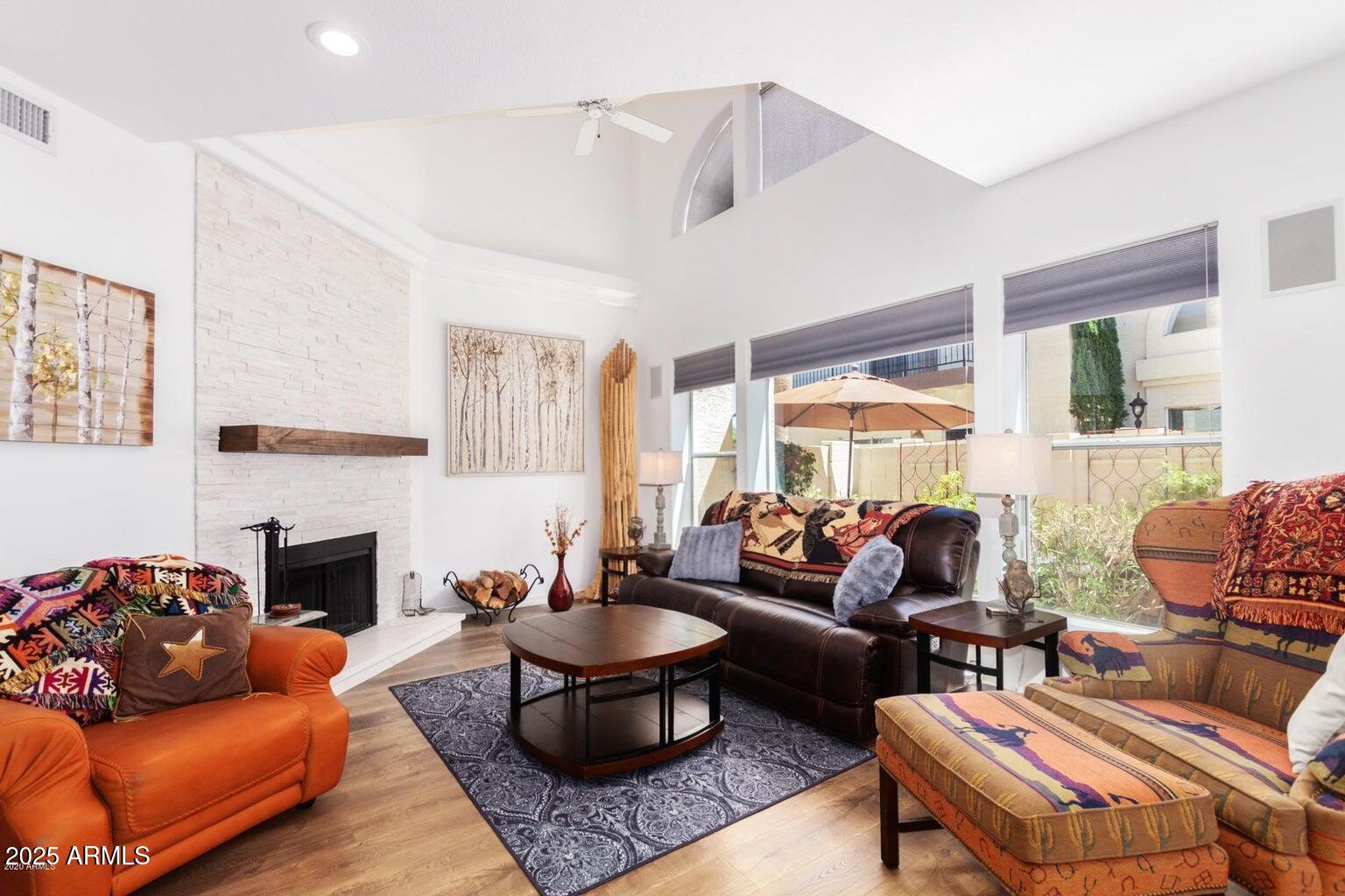 8841 South 51st Street, Unit 1 Phoenix, AZ 85044 - Photo 7 of 23 a living room with furniture fireplace and a table