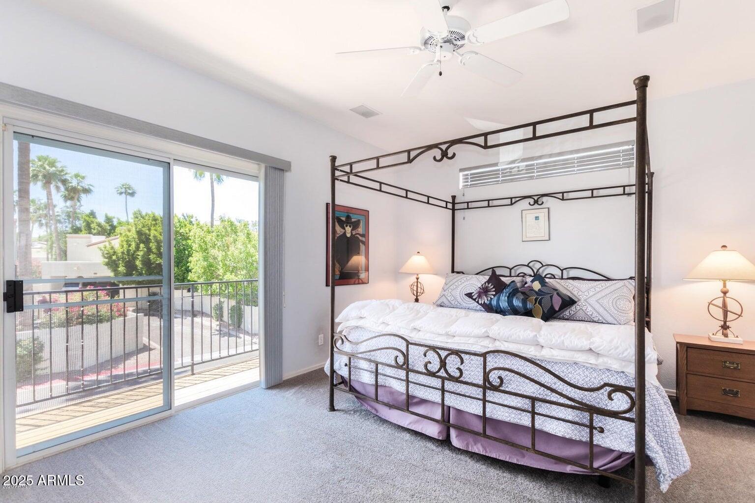 8841 South 51st Street, Unit 1 Phoenix, AZ 85044 - Photo 10 of 23 a bedroom with a bed with large windows