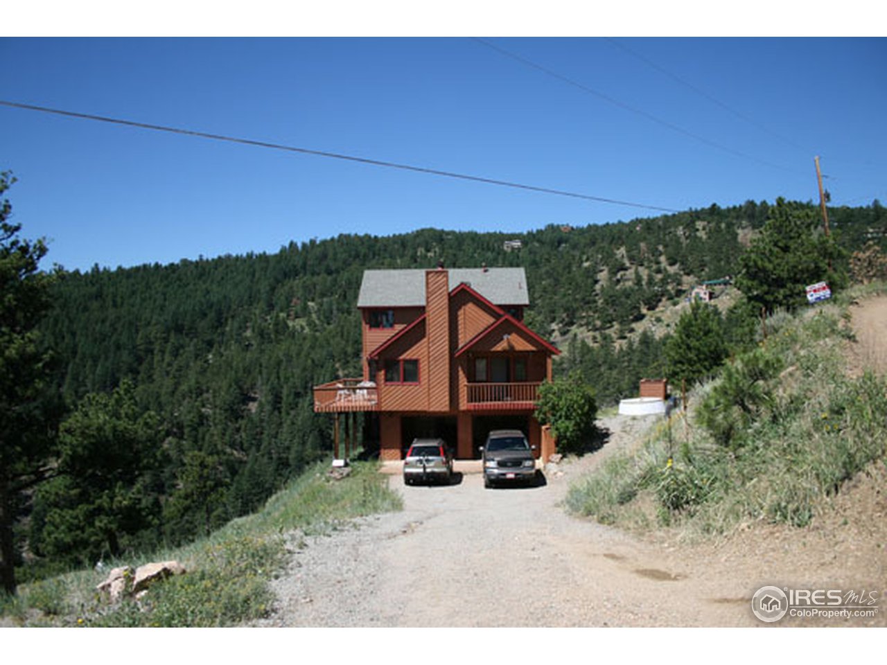 356 Ridgeview Lane Boulder, CO 80302 - Photo 19 of 25 a view of a house with a yard