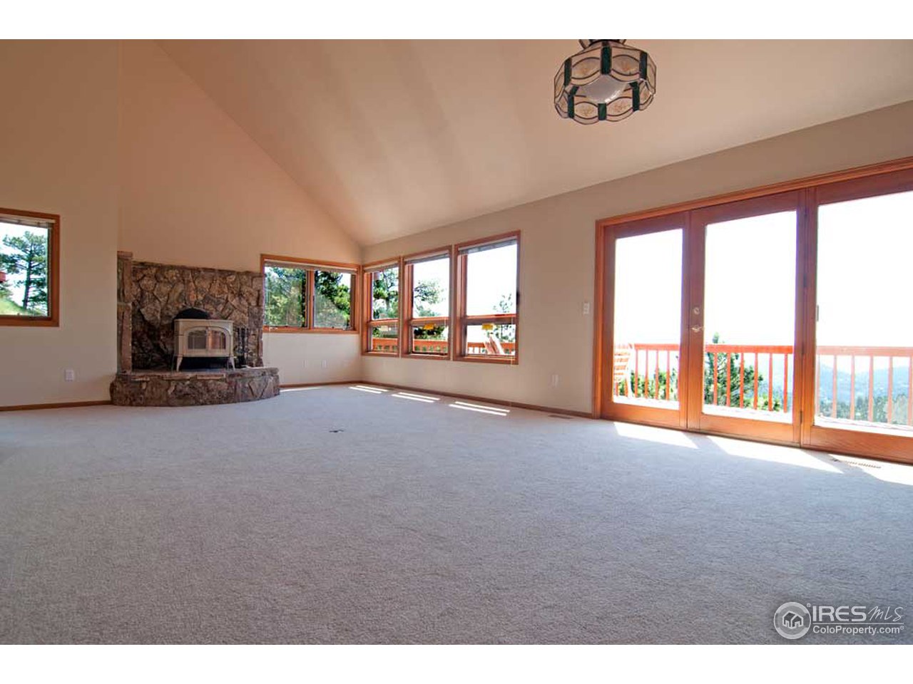356 Ridgeview Lane Boulder, CO 80302 - Photo 3 of 25 a view of a livingroom with an empty space and a fireplace