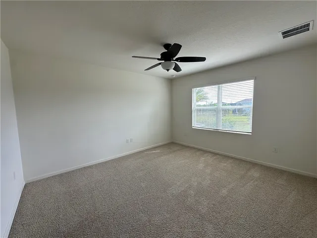 a bathroom with a granite countertop sink a mirror and a vanity